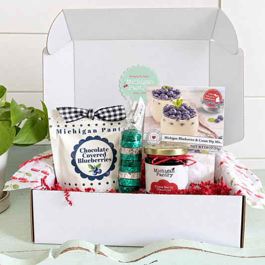 gift box with chocolate covered blueberries, mints, jam and dip 